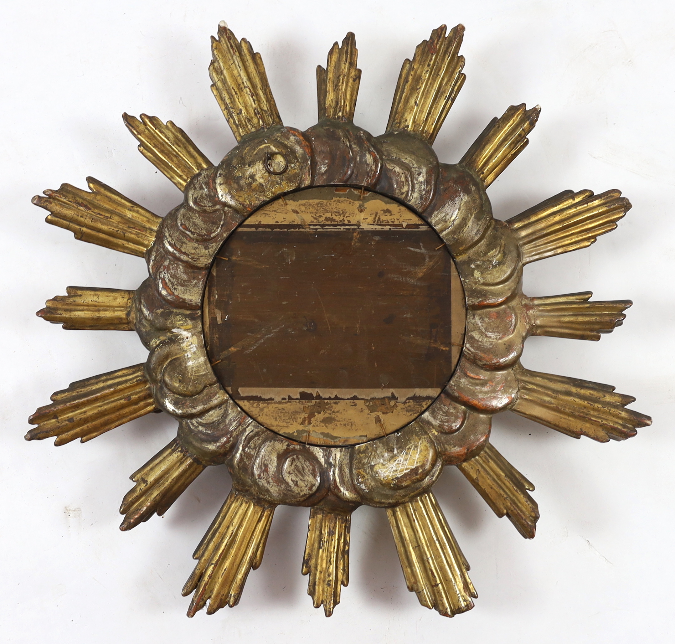 A Baroque Revival silvered and giltwood sunburst wall mirror